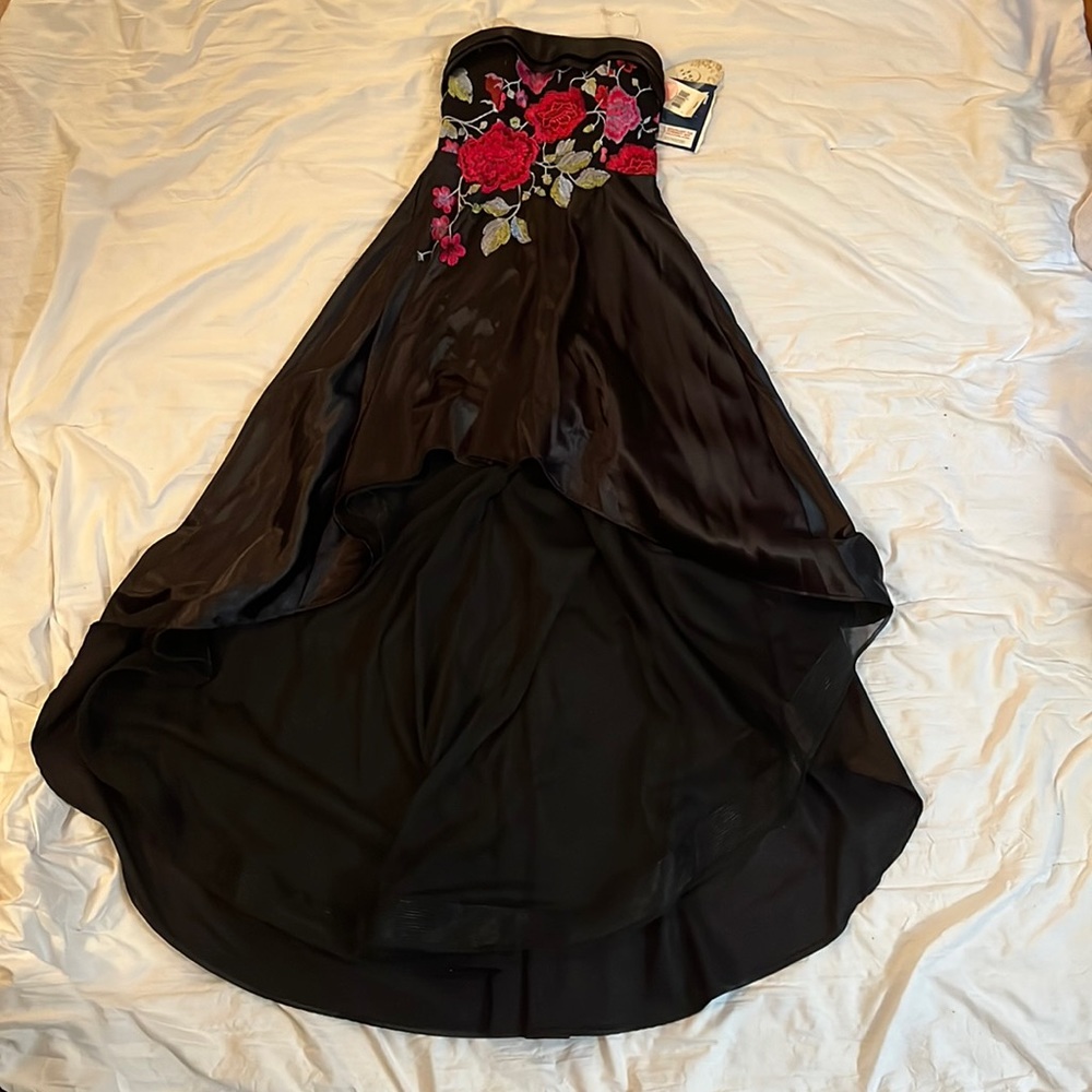 Black strapless hi-low dress with floral pattern front top and corset back